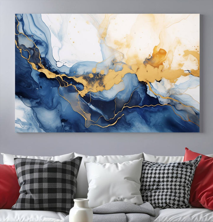 A contemporary living room featuring the "Navy Blue Gold Abstract Wall Art Canvas Print" on the wall, displayed on a gallery-wrapped, museum-quality canvas.