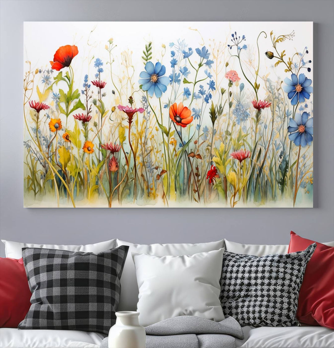 The Colorful Wildflower Canvas Wall Art – Vibrant Floral Botanical Print, consisting of a large 3 panel set, adds bright nature decor to the living room against a black wall.