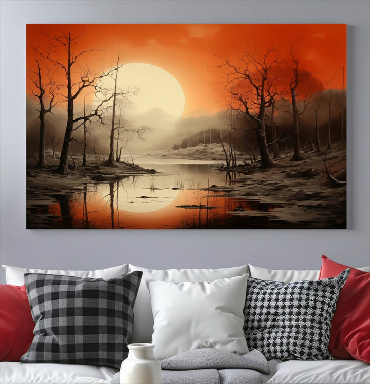 The "Abstract Watercolor Trees and Sunset on Lake Wall Art" is a triptych masterpiece, showcasing an orange-hued landscape of barren trees and a large sun. Displayed on museum-quality canvases with UV-protective coating, it creates a striking visual element in any space.