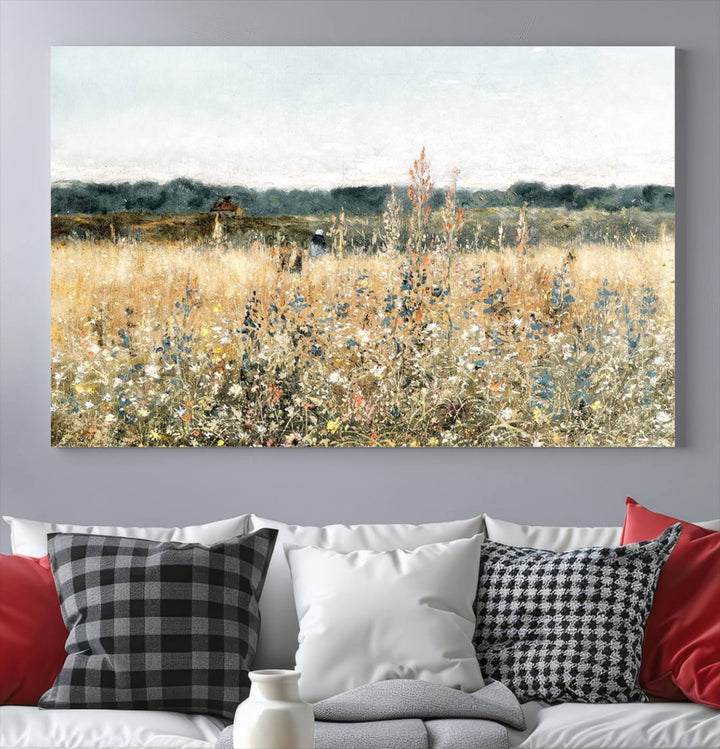 The "Wildflower Field Wall Art Canvas" brings rustic charm to the room with its nature-inspired landscape print, making it a perfect addition to the living room or office.