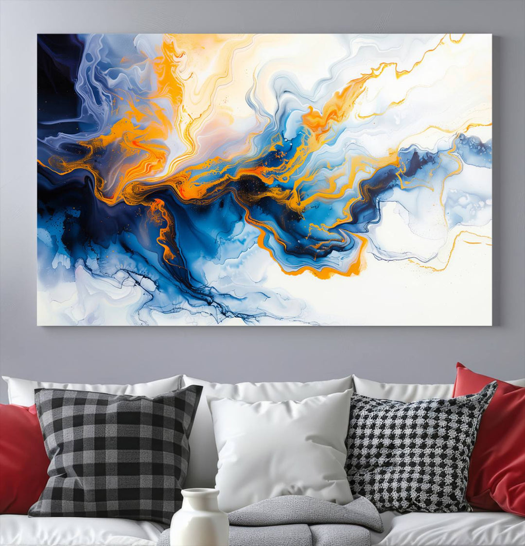 A stunning Fluid Alcohol Ink Wall Art with Gold Wall Art Canvas Print, featuring vibrant blue, orange, and white swirls, adorns the wall. This gallery-quality finish adds an exquisite touch to any living space.