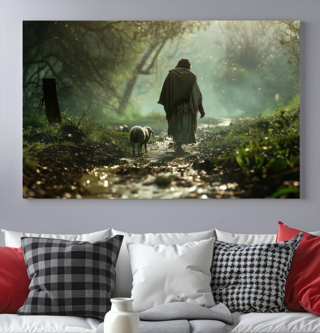 The wall art piece, titled "Jesus Shepherd a Lost Lamb Canvas Wall Art Print," is suspended on the wall and depicts a robed figure and a lamb wandering along a forest path.