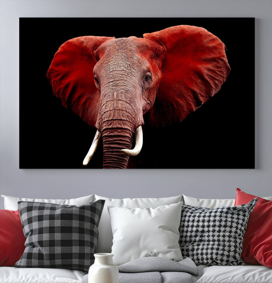 A Wall Art Canvas Print in the modern living room features a three-panel premium design of a red elephant face.