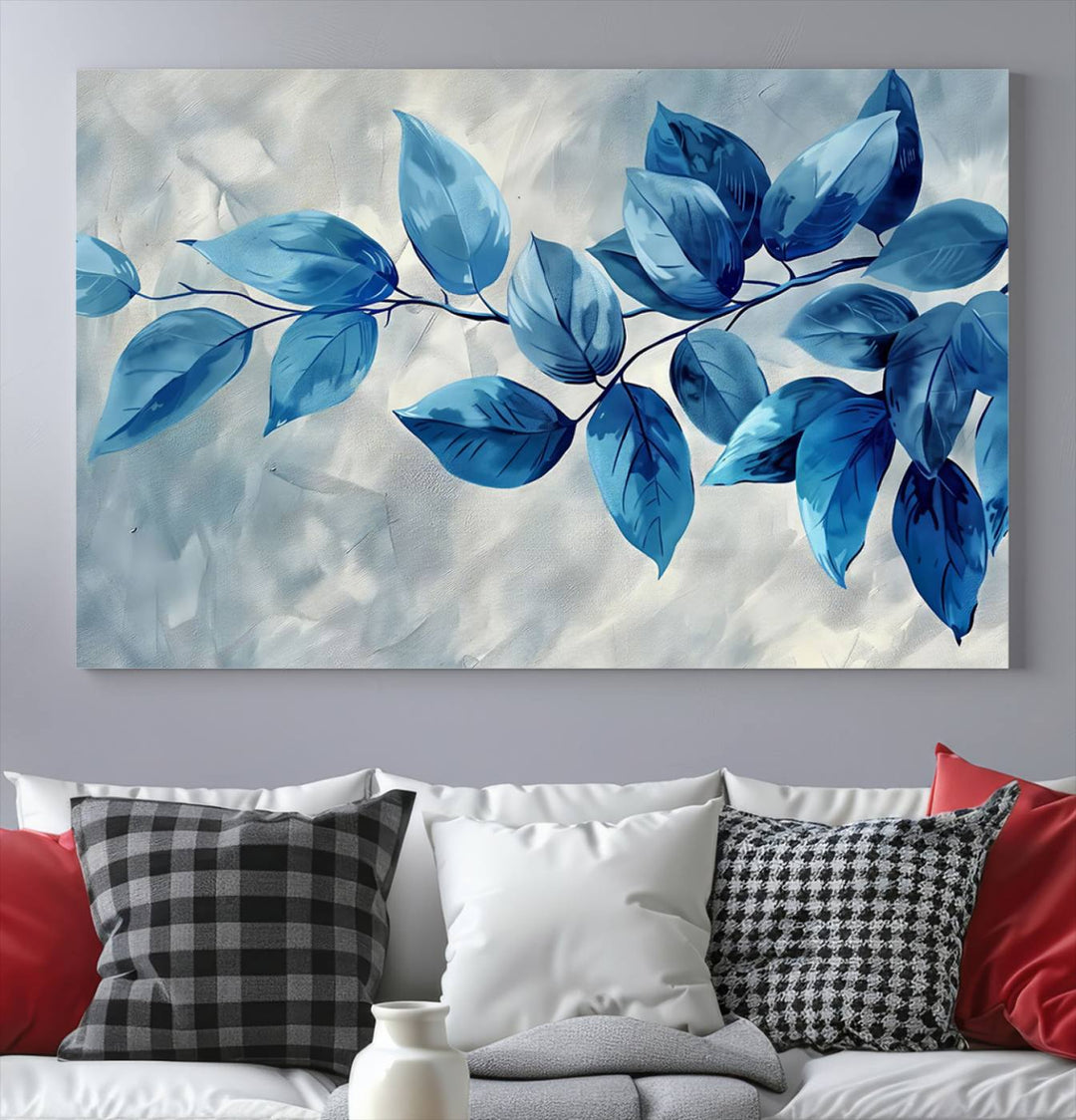 A Blue Leaf Abstract Wall Art Canvas Print, featuring a textured background and gallery-quality finish, is displayed.