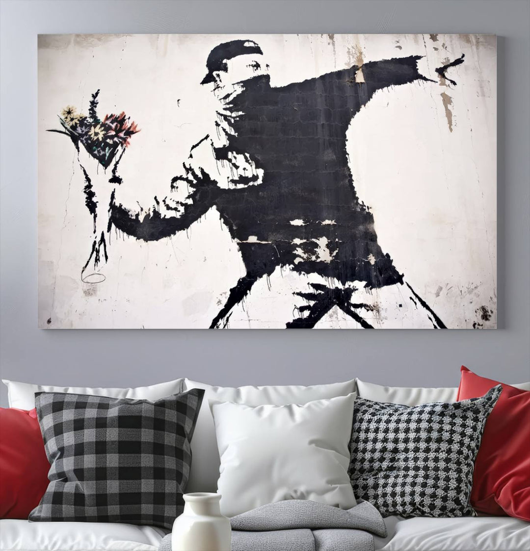 The living room features a split-panel art piece named "Banksy Flower Throw Graffiti Street Wall Art Canvas Print," gallery wrapped on museum-quality polycotton canvas and accentuated by modern decor elements.