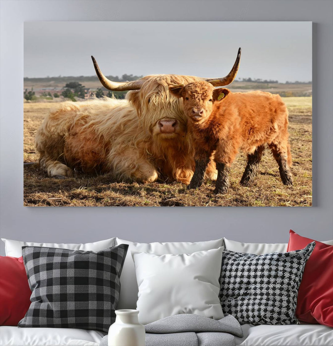 The three-panel canvas artwork, titled "Highland Cow Canvas Wall Art Animal Print for Farm House Decor," features a serene scene of a resting Highland cow and calf in a field. The piece highlights its gallery-quality finish.