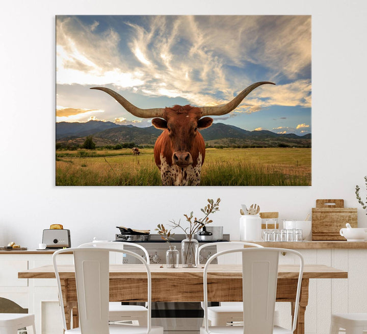 The Texas Longhorn Canvas Wall Art showcases a majestic longhorn steer in a field encircled by mountains under a cloudy sky. Ideal for enthusiasts of rustic western decor, this piece beautifully captures the essence of majestic triptych animal print.