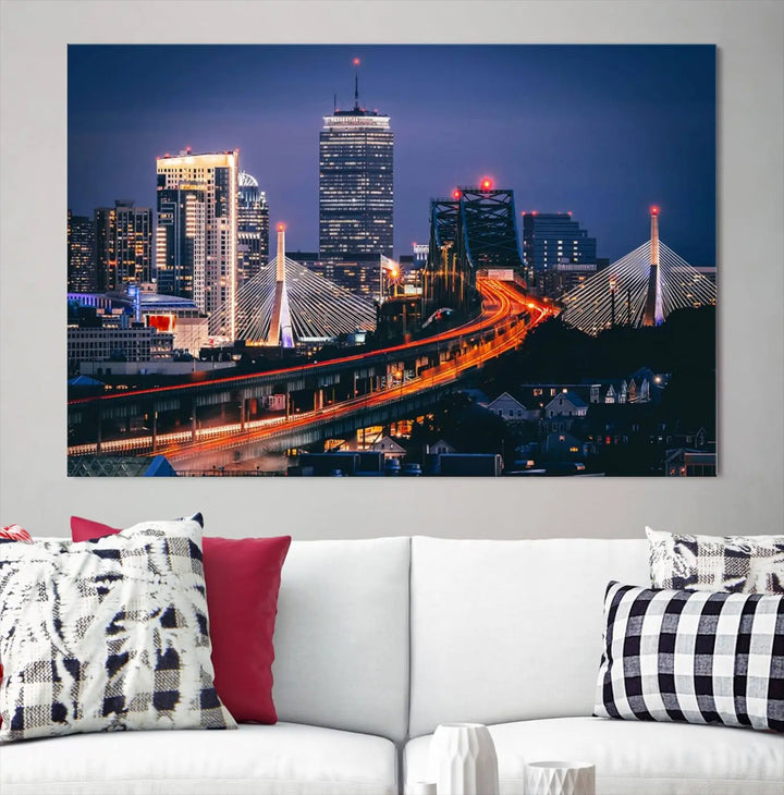 The "Boston City Lights Night Skyline Cityscape View" artwork on the wall showcases a brightly lit bridge at night. It is displayed on museum-quality canvas with a UV-protective coating.