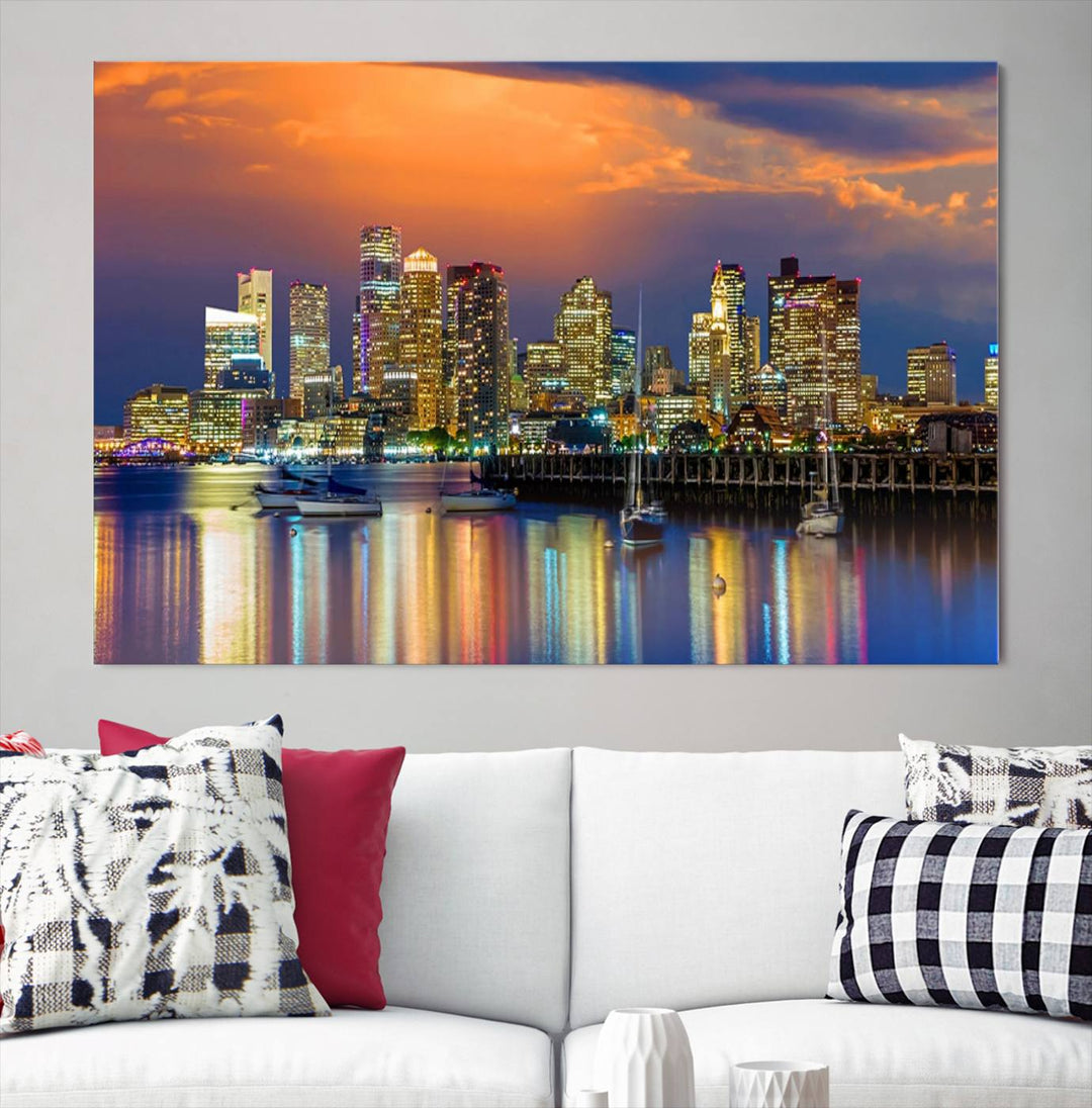 A contemporary dining area features a large triptych wall art of the Boston City Night skyline in blue and orange hues, printed on museum-quality canvases to ensure lasting beauty.