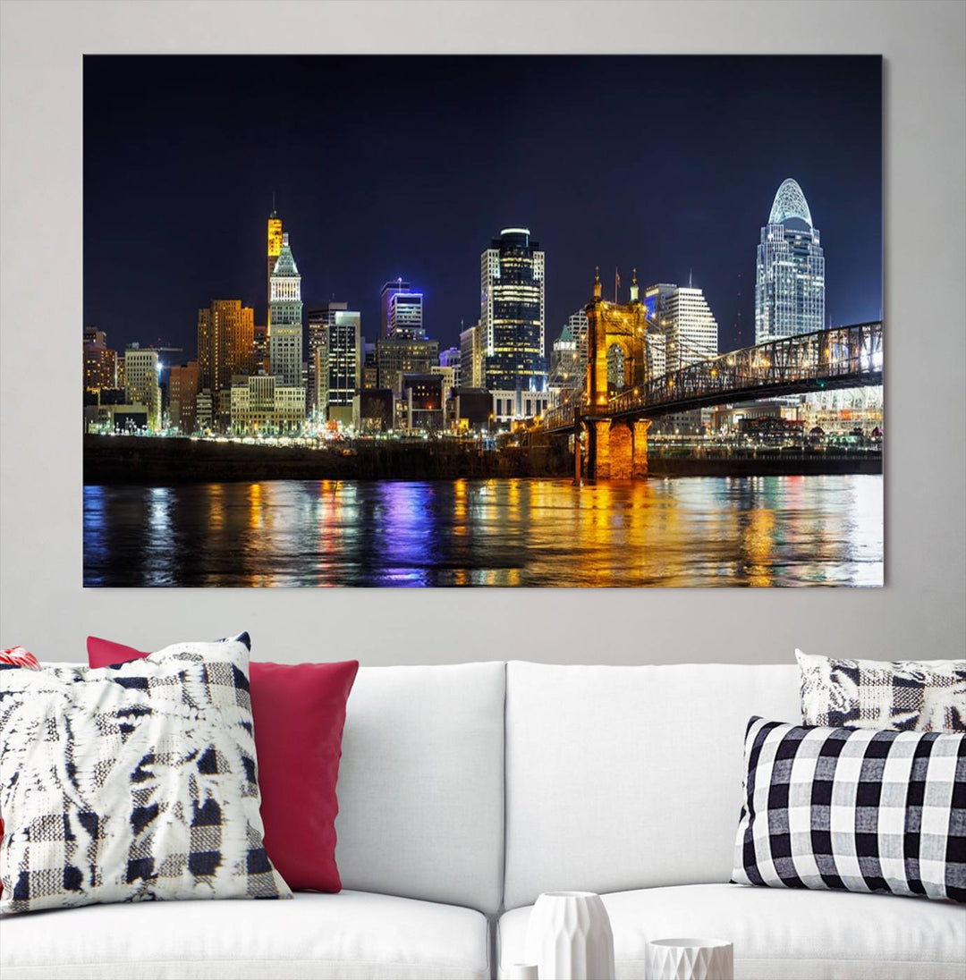 The Cincinnati City Lights Night Skyline Cityscape View Wall Art Canvas Print, crafted on museum-quality canvas with UV-protective coating and ready to hang, adds a touch of sophistication to the wall.