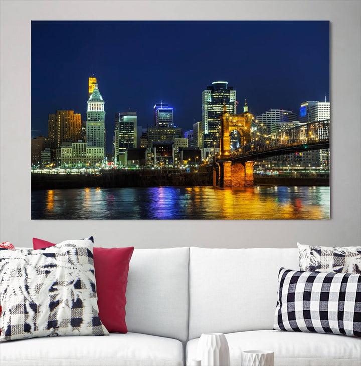 The "Cincinnati City Lights Night Skyline Cityscape" canvas print, displayed above a sofa, exhibits museum-quality craftsmanship with a UV-protective coating.