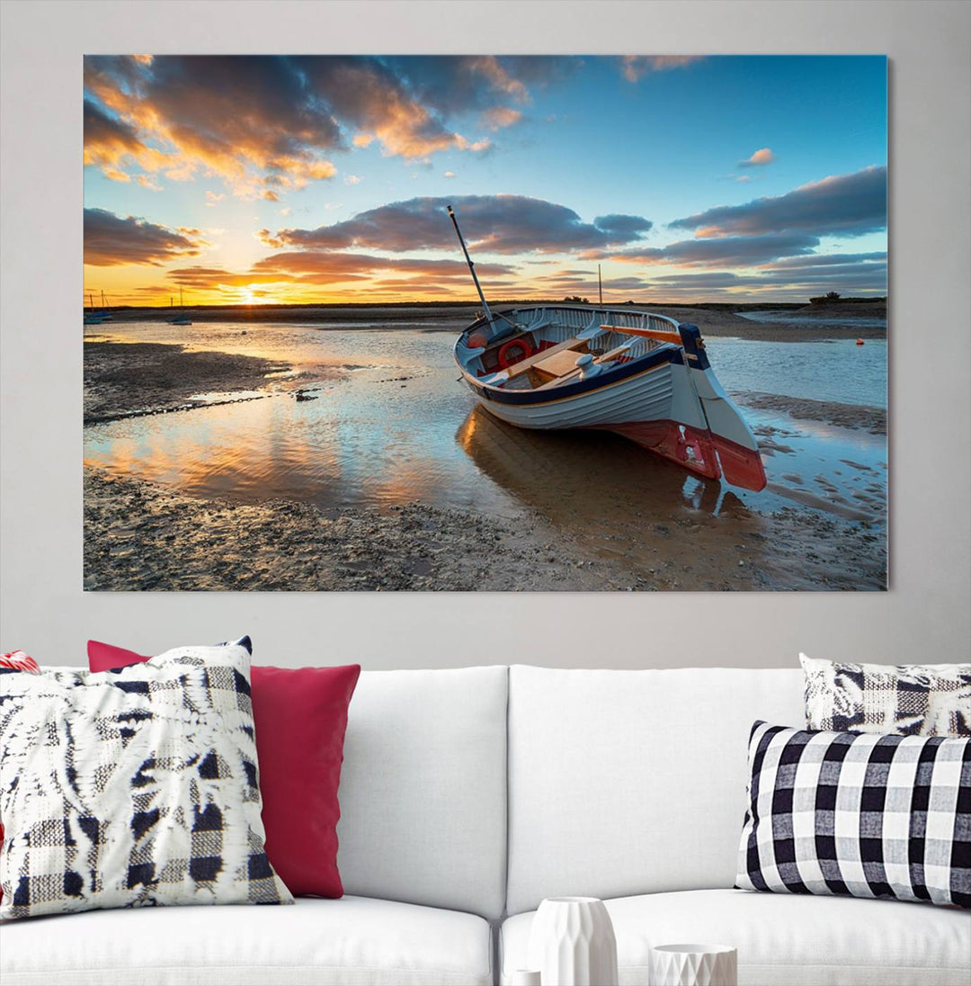 The "Small Boat At The Beach Sunset Wall Art Canvas Print," a three-panel masterpiece crafted on museum-quality canvas, hangs elegantly.