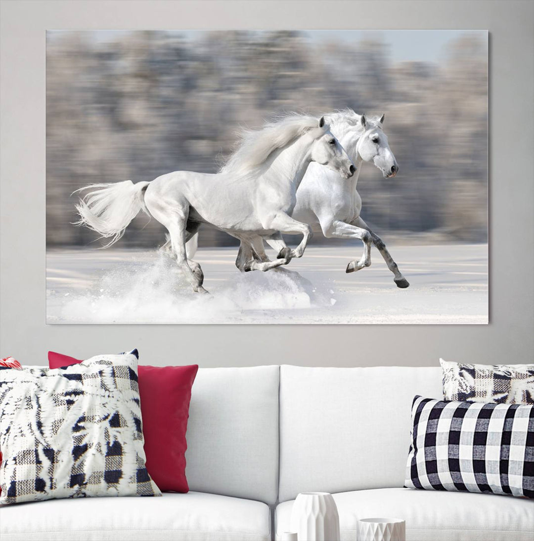 The "All The White Horses Wall Art Canvas Print" depicts a triptych of galloping white horses across a snowy landscape. These museum-quality canvases come with a UV-protective coating to maintain their stunning appearance over time.