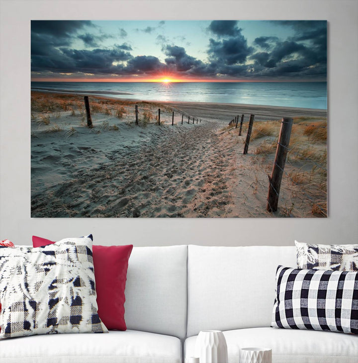 The modern living room features the Cloudy Weather Sunset Beach Wall Art Canvas Print. This museum-quality canvas adds a touch of sophistication with its hand-assembled framed art, ensuring lasting elegance. Enjoy free shipping on this exquisite piece.