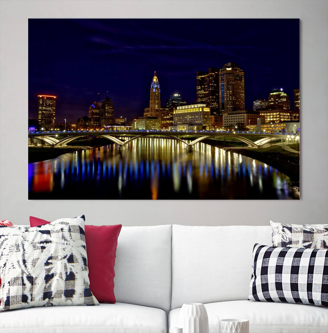 The "Columbus City Lights Night Skyline Cityscape View Wall Art Canvas Print" showcases a stunning city skyline at night, with illuminated buildings and bridges reflecting in the river, on a museum-quality canvas ready to hang.