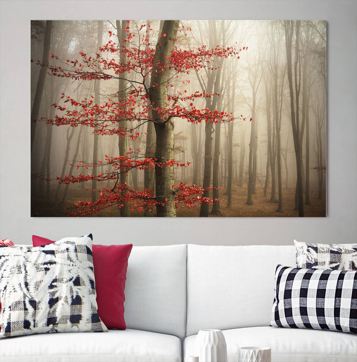 The living room features the Foggy Forest Wall Art, an Autumn Trees Canvas Print that showcases a serene nature scene with foggy woodland decor and a tree adorned in vibrant red leaves.