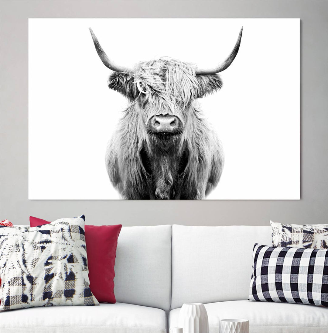 The wall art features a triptych of a Scottish Highland cow, printed on museum-quality canvases with a UV-protective coating. This decorative piece is known as the Highland Cow Canvas Wall Art Farm House Wall Art.