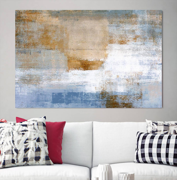 The Blue Multi Panel Abstract Wall Art Canvas Print, featuring an elegant blend of blue, beige, and brown tones, hangs gracefully on the wall, adding a contemporary touch to the space.