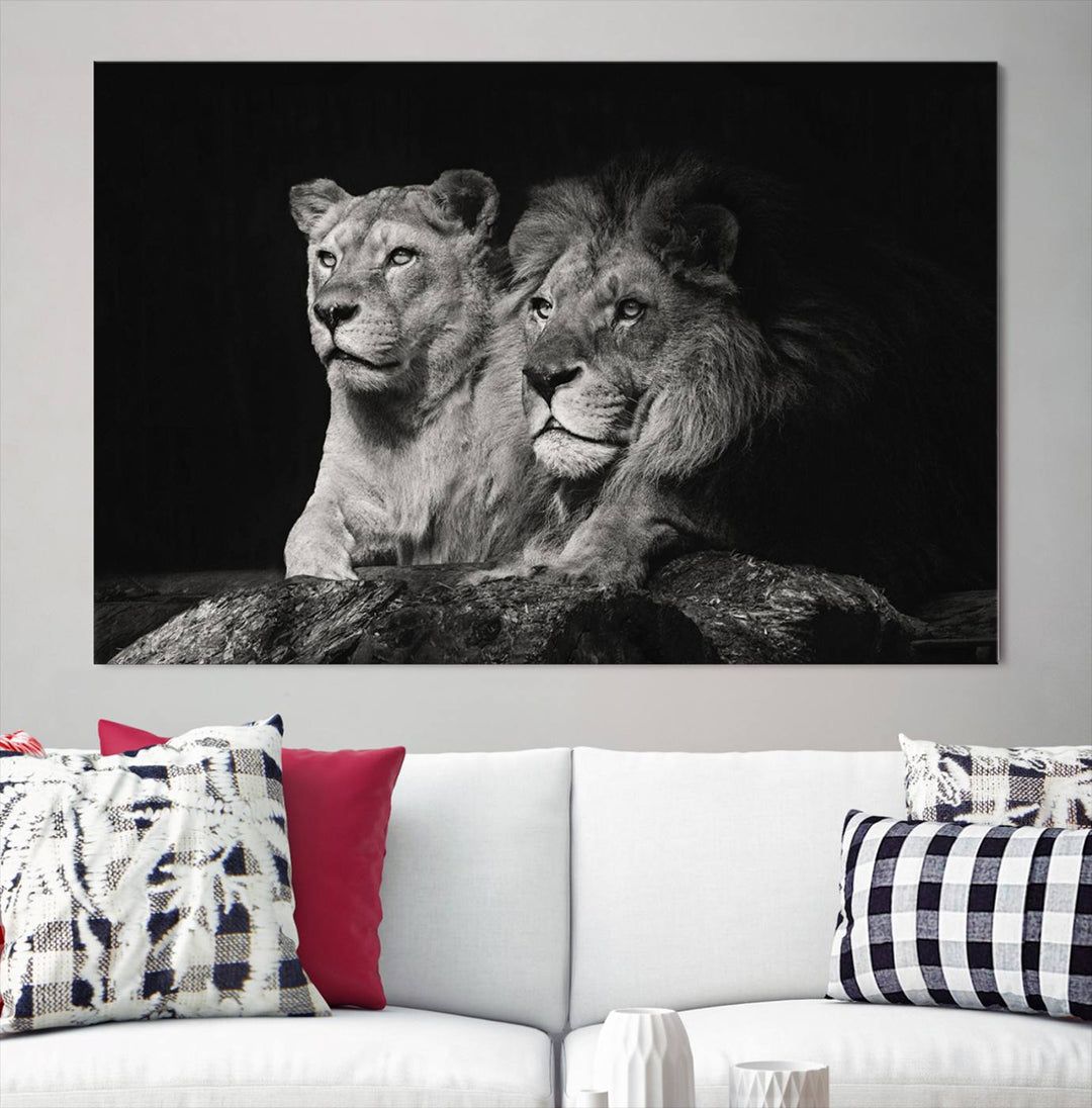 The elegant wildlife portrait, "Lion Couple Canvas Wall Art Print," featuring a black and white depiction of a lion family, majestically decorates the living room wall.