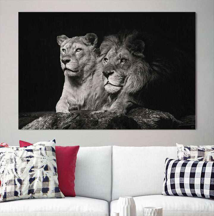 The elegant wildlife portrait, "Lion Couple Canvas Wall Art Print," featuring a black and white depiction of a lion family, majestically decorates the living room wall.