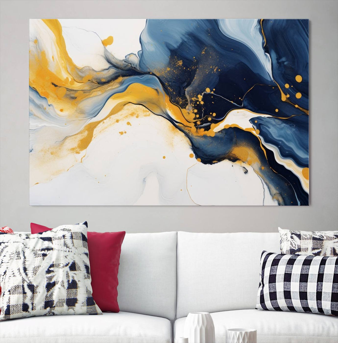 The Blue and Gold Abstract Fluid Canvas Art, with its swirling patterns, adorns the wall. This modern wall art beautifully complements the contemporary interior decor, adding an elegant touch with its rich blue, gold, and white tones.