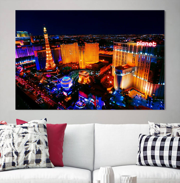 Las Vegas Wall Art Canvas Print showcases a dynamic and luminous cityscape at night with tall buildings and bustling streets. Expertly printed on museum-quality canvas, this gallery-wrapped artwork is enhanced with a UV-protective coating to ensure lasting brilliance.