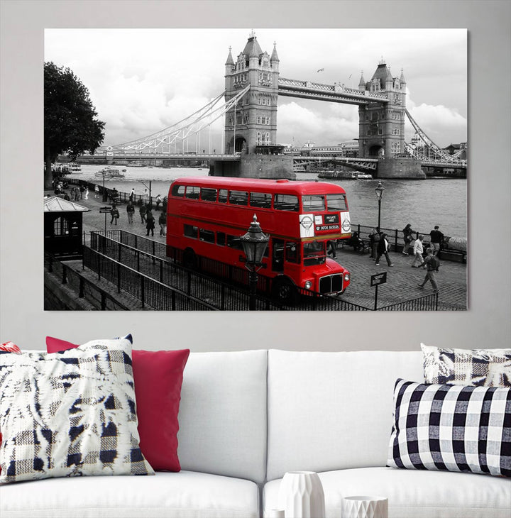 The London Red Bus and Bridge Wall Art Canvas Print showcases a red London bus in front of Tower Bridge, beautifully presented as a gallery-wrapped canvas. This striking image is divided into three panels, delivering a museum-quality display that's ready to hang.