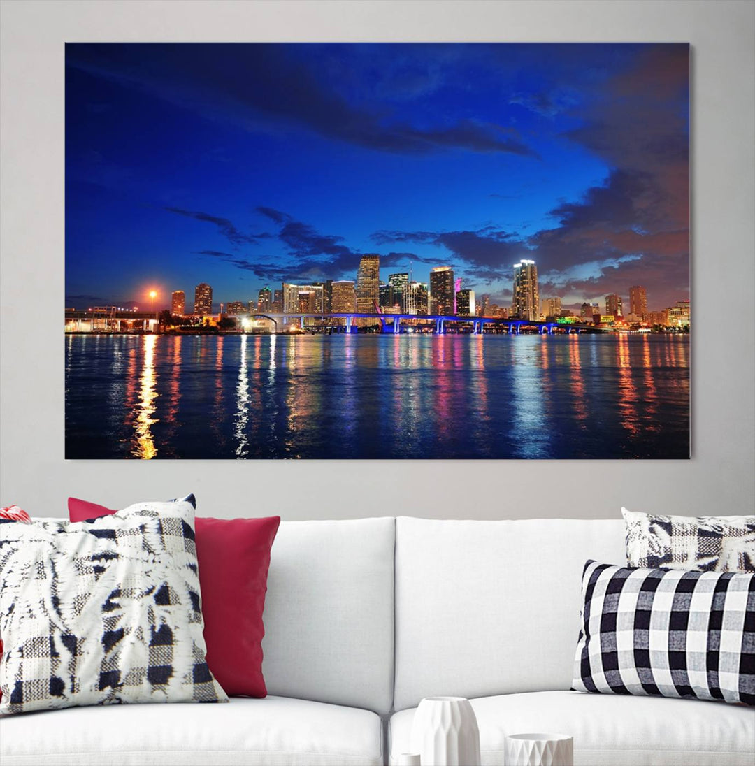 A large Miami City View Wall Art Canvas Print featuring the Miami City Skyline Panorama at night is displayed above the dresser.