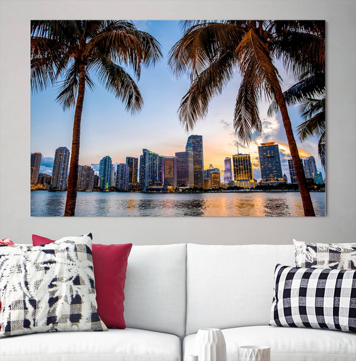 The Wall Art MIAMI Canvas Print features a triptych design depicting palm trees and a city skyline at sunset.