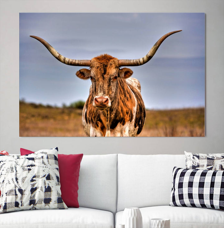 The Texas Longhorn Wall Art Print, a triptych canvas artwork depicting a longhorn bull in a field, features a gallery-quality finish.