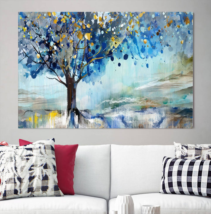 A modern living room features a three-panel Watercolor Style Abstract Tree Printing Wall Art Canvas in vibrant blue and yellow, crafted on museum-quality material.