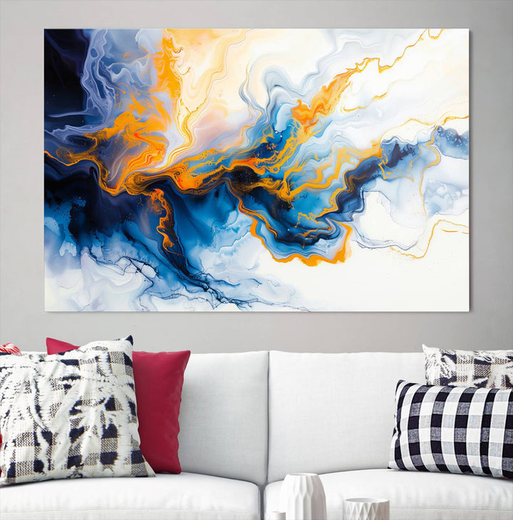 A stunning Fluid Alcohol Ink Wall Art with Gold Wall Art Canvas Print, featuring vibrant blue, orange, and white swirls, adorns the wall. This gallery-quality finish adds an exquisite touch to any living space.