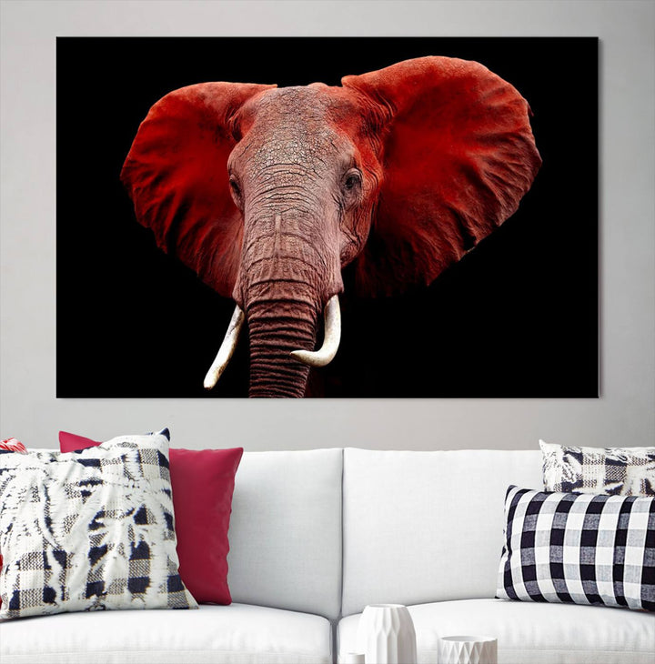 A Wall Art Canvas Print in the modern living room features a three-panel premium design of a red elephant face.