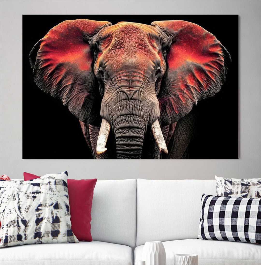 The Elephant Wall Art Canvas Print, featuring vibrant red and black tones, is a stunning artwork printed on museum-quality canvas. It comes with a UV-protective coating.