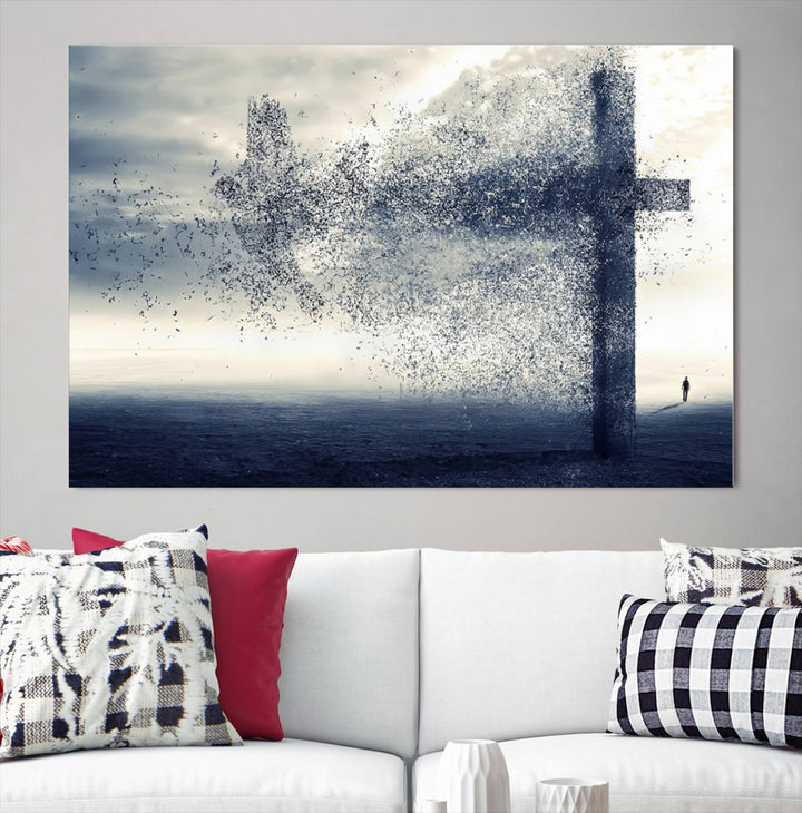 The "Jesus and the Fading Cross – Symbol of Faith" framed canvas print beautifully depicts a cross formed by birds against a moody sky above an ocean. This piece of Christian wall art infuses spirituality into the minimalist space.