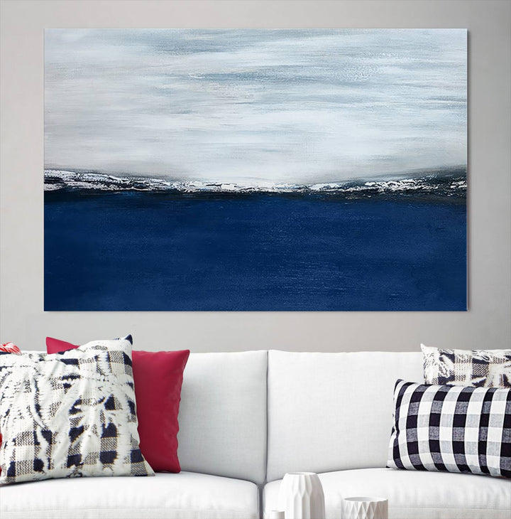 The modern living room is enhanced by the Navy Blue Abstract Wall Art Canvas Print on the wall, crafted as handmade wall art with a gallery-quality finish.