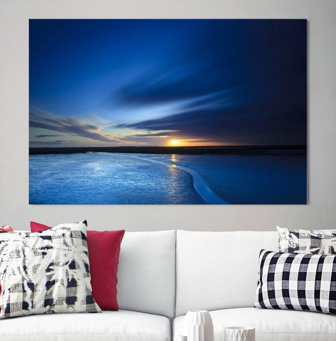 The living room features a triptych of the Wall Art Canvas Print Navy Sunset Lake Landscape Artwork, adding to its tranquil vibe.