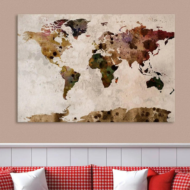 A Watercolor World Map Canvas Print, wrapped in an elegant gallery style, hangs on the wall.