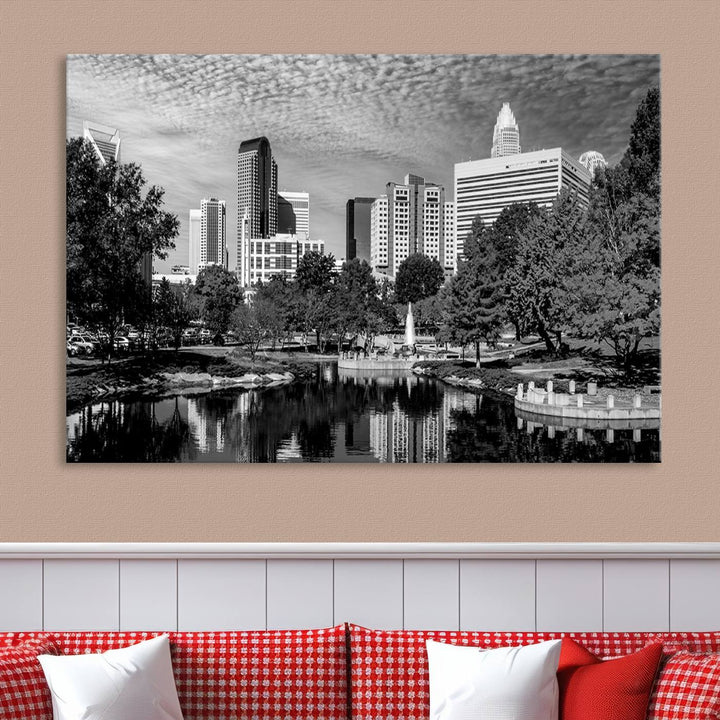 The living room features a captivating triptych titled "Charlotte City Cloudy Skyline Black and White Wall Art Cityscape Canvas Print," crafted on museum-quality canvas with UV-protective coating. Modern decor accentuates the dynamic scene.