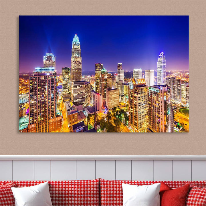 A modern living room features the Charlotte City Lights Night Blue Skyline Cityscape View wall art canvas print.