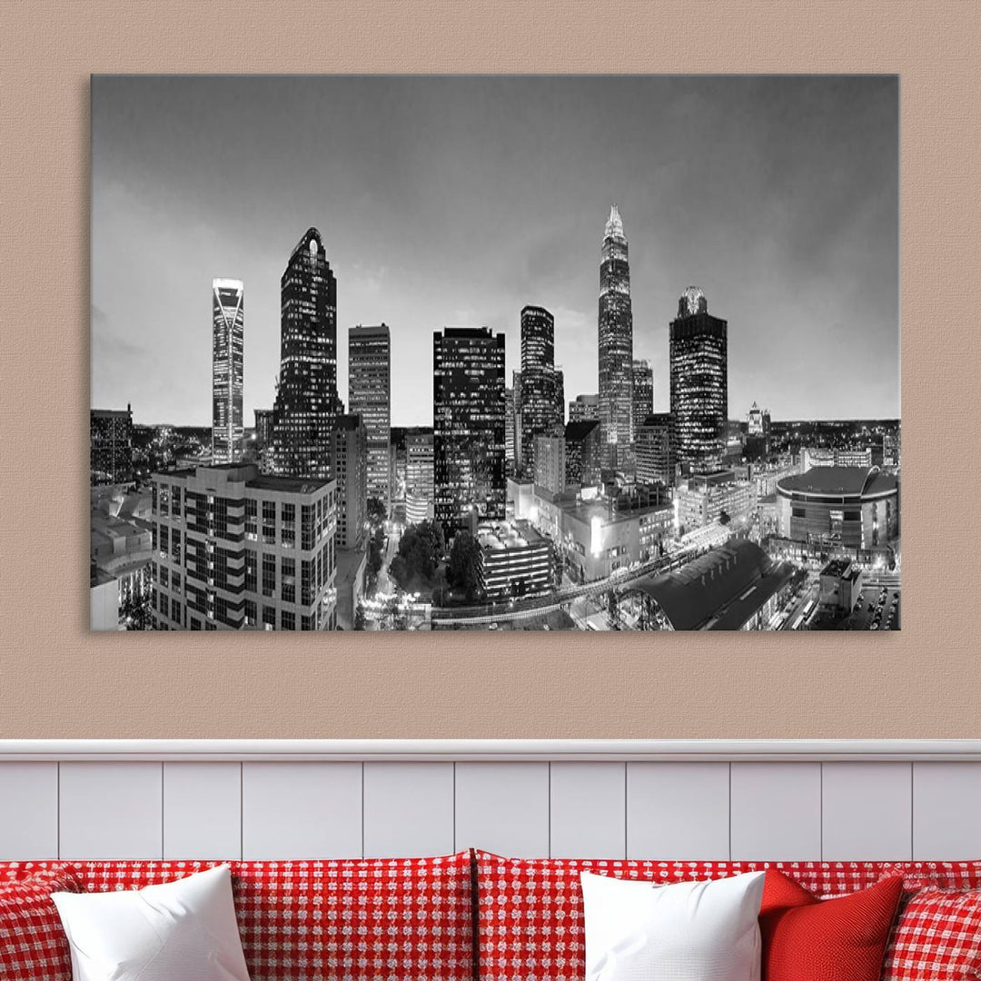 The "Charlotte City Cloudy Skyline Black and White Wall Art Cityscape Canvas Print" hangs on a dark wall, showcasing its UV-protective properties for enduring beauty.