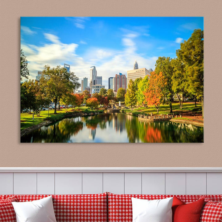 The Charlotte City Park at Spring Skyline Cityscape View wall art canvas print is a triptych featuring a scenic park with a lake and city skyline. It is gallery-wrapped on museum-quality canvases.