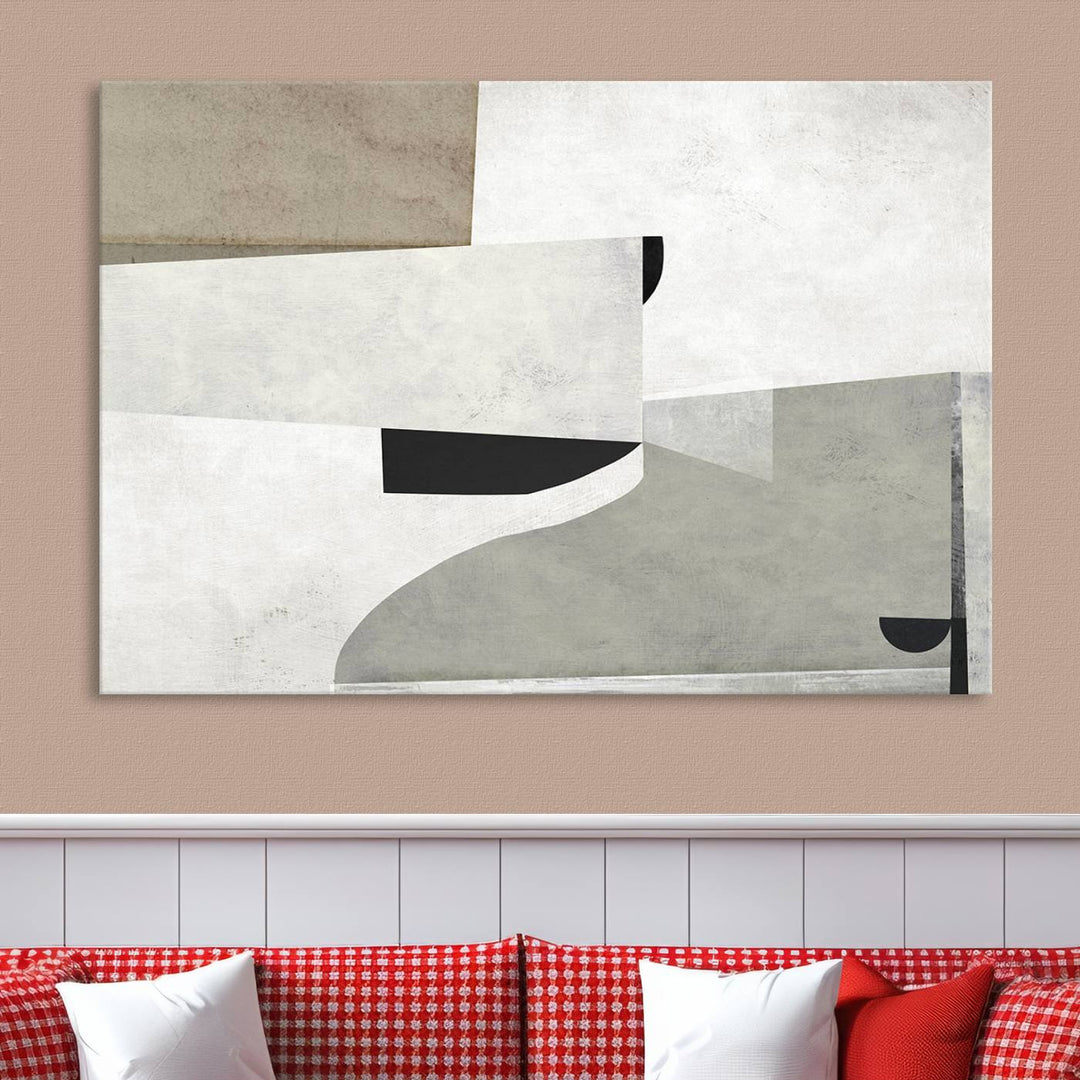 The Brown Gray Figures Abstract Wall Art Canvas Print is displayed as a triptych on a dark wall. The piece is gallery wrapped, offering a seamless finish and enhanced durability due to its UV-protective coating.