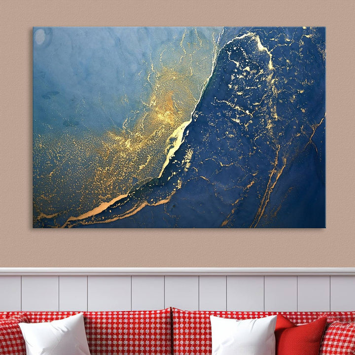 The Navy Blue Yellow Twinkle Wall Art Canvas Print, featuring an abstract design in gold and blue, enhances a modern living room as it adorns a white wall with its gallery-wrapped, museum-quality canvases for an exquisite touch.