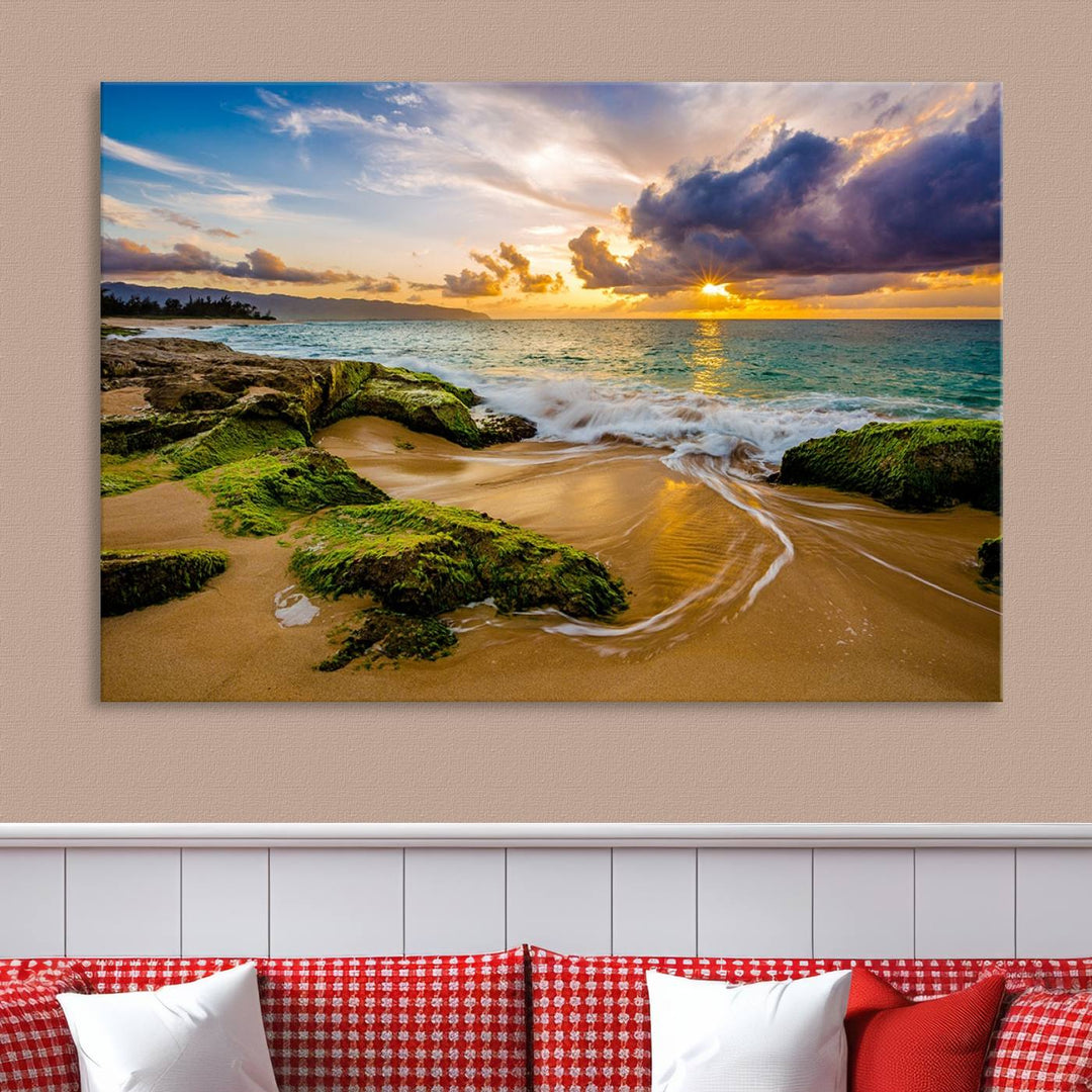 The Sunset Beach Wall Art Canvas Print is a gallery-wrapped triptych showcasing a beach scene with mossy rocks and a vibrant sunset. Made from museum-quality canvas and featuring a UV-protective coating, it elegantly provides both beauty and durability.