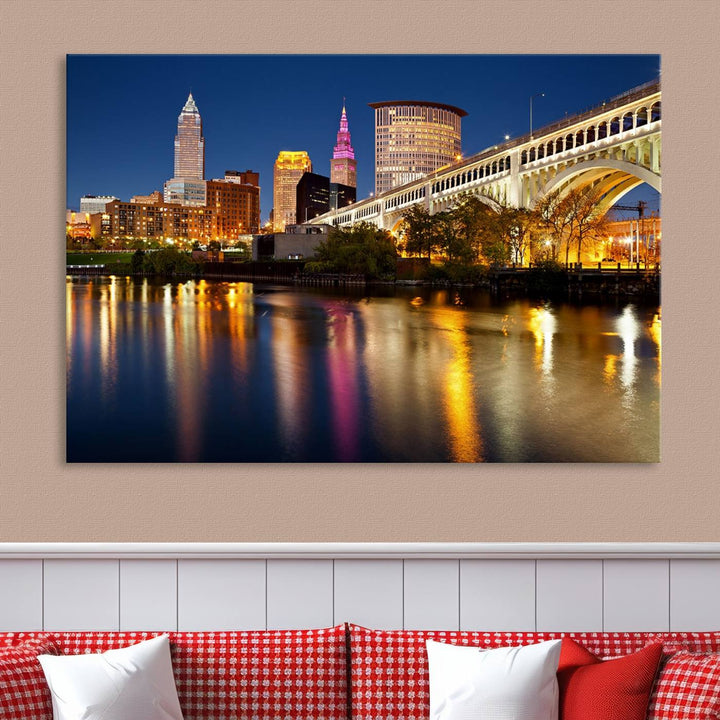 The "Cleveland Night Skyline Wall Art City Cityscape Canvas Print" is a striking feature in the room, showcasing a city skyline with a bridge reflecting in a river. Displayed on museum-quality canvas, it offers enduring beauty.