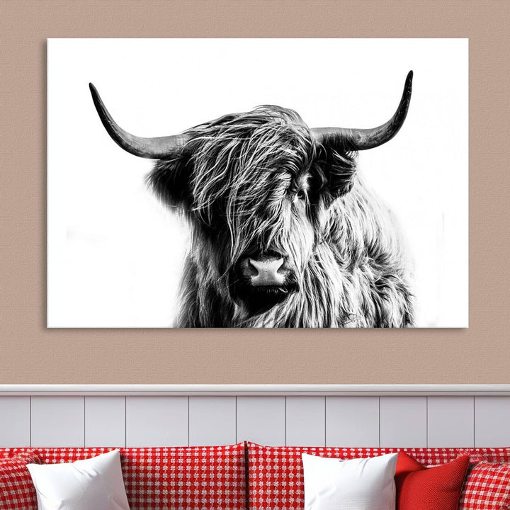 The Scottish Highland Cow Cattle Art Print Farmhouse Wall Art Canvas Print enhances rustic farmhouse decor with its depiction of a long-haired, large-horned cow. This triptych is an ideal choice for chic wall art.