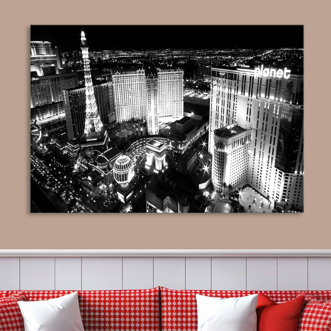 The Las Vegas Wall Art Canvas Print is a black and white triptych that showcases a city skyline at night. Crafted on museum-quality canvas with a UV-protective coating, it serves as an elegant and ready-to-hang focal point in the room.