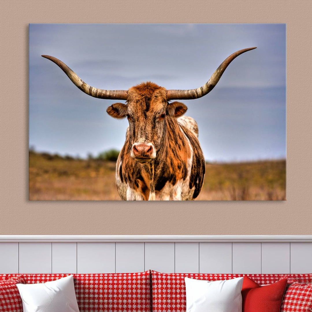 The Texas Longhorn Wall Art Print, a triptych canvas artwork depicting a longhorn bull in a field, features a gallery-quality finish.