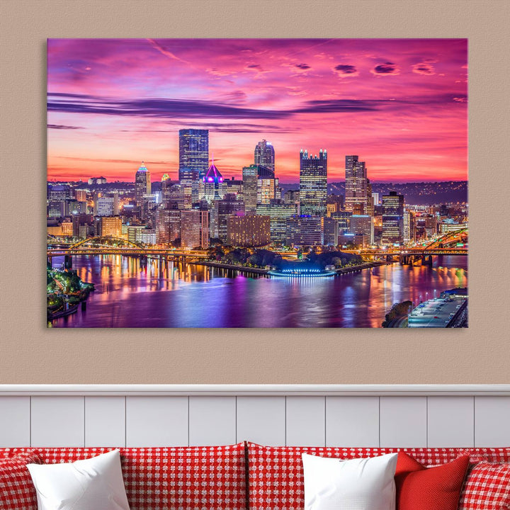 The Pittsburg Wall Art Canvas Print, showcasing a vibrant sunset glow over the city skyline and crafted by a professional artisan, adorns the space.